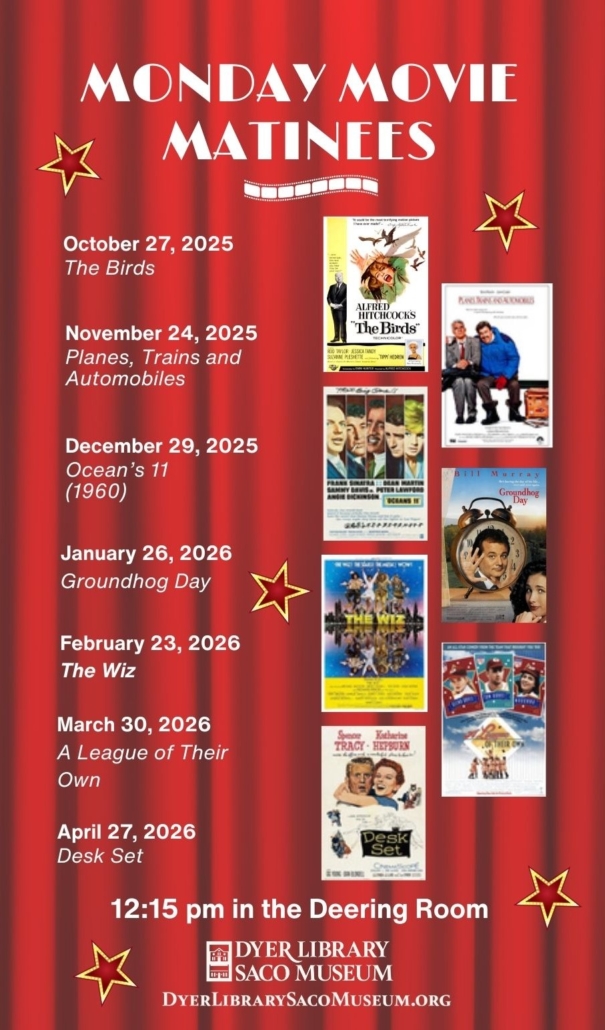 red curtain backdrop with movie posters