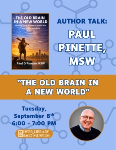 white man with glasses smiling and a book cover with a caveman