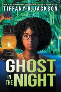 a girl holding up a lantern